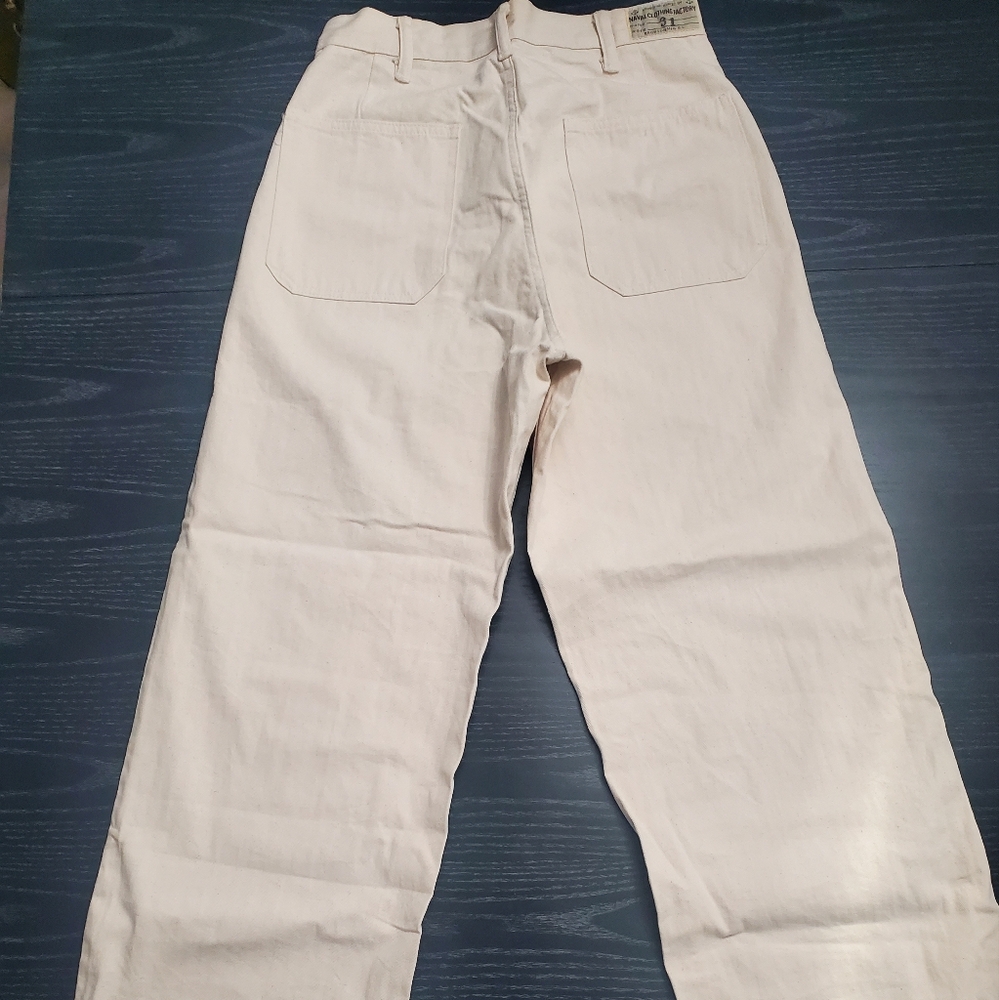 Cream color pants with buttons Naval clothing.